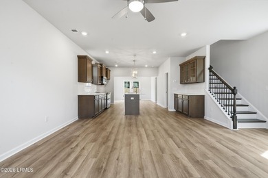 This two-story home includes three bedrooms and two and one-half - photo 4