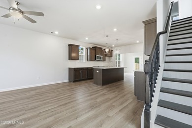 This two-story home includes three bedrooms and two and one-half - photo 6
