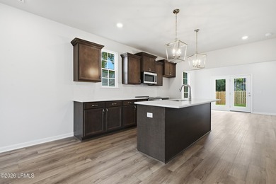 This two-story home includes three bedrooms and two and one-half - photo 7