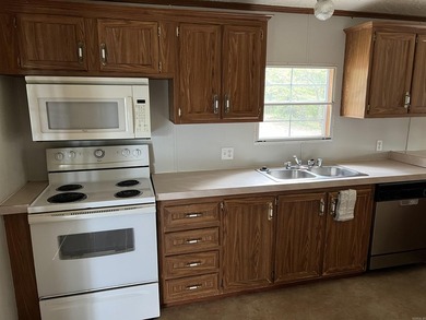 Nestled on 20 beautiful wooded acres, this 3-bedroom, 2-bath - photo 17