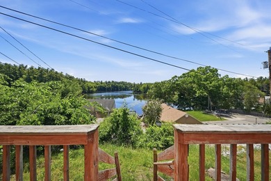 Wake up to sweeping views of Pine Island Pond from this charming - photo 3
