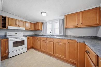 Wake up to sweeping views of Pine Island Pond from this charming - photo 5