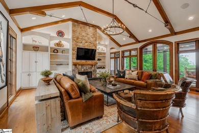 Beneath a vaulted ceiling lined with exposed wood beams and - photo 9