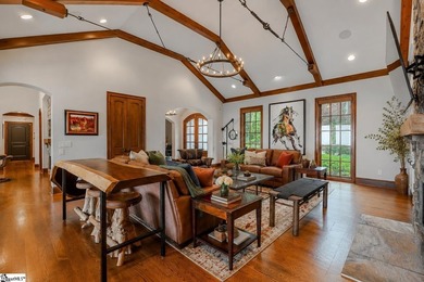 Beneath a vaulted ceiling lined with exposed wood beams and - photo 10
