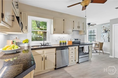 Nestled in the heart of Isle of Hope on large corner lot, this - photo 13