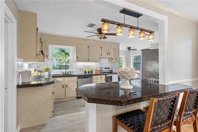 Nestled in the heart of Isle of Hope on large corner lot, this - photo 14