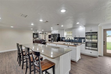 Experience this breathtaking custom home in the highly - photo 3
