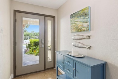 Set within a gated, waterfront community in Oldsmar, this - photo 2