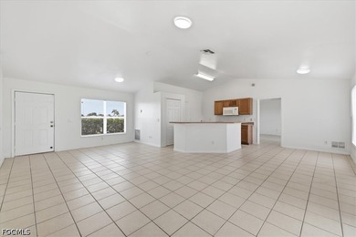 3-bedroom, 2-bath home offering an open-concept layout with tile - photo 13