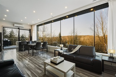 Lake Home For Sale in Sainte-Marguerite-du-Lac-Masson, QC