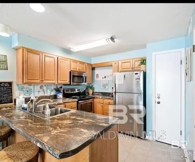 Check out this adorably decorated 2-bedroom, 2-bath condo with - photo 4