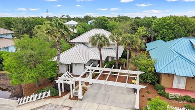 Located in The Beach Club Cottages, this home offers the - photo 5