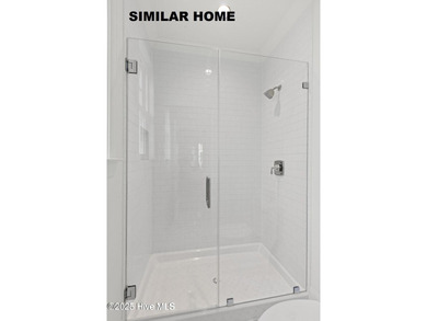 Discover unparalleled coastal living at 607a S Topsail Drive