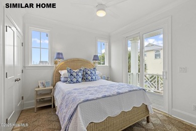 Discover unparalleled coastal living at 607a S Topsail Drive