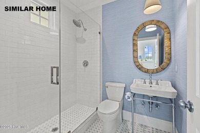 Discover unparalleled coastal living at 607a S Topsail Drive