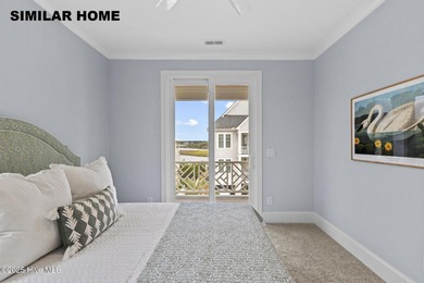 Discover unparalleled coastal living at 607a S Topsail Drive