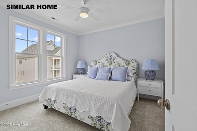 Discover unparalleled coastal living at 607a S Topsail Drive