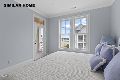 Discover unparalleled coastal living at 607a S Topsail Drive