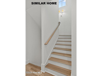 Discover unparalleled coastal living at 607a S Topsail Drive