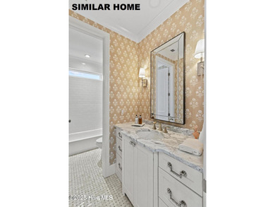 Discover unparalleled coastal living at 607a S Topsail Drive