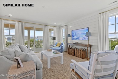 Discover unparalleled coastal living at 607a S Topsail Drive