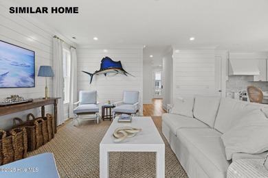 Discover unparalleled coastal living at 607a S Topsail Drive