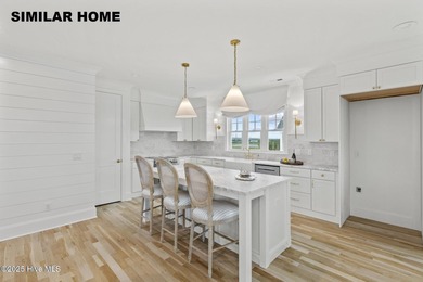 Discover unparalleled coastal living at 607a S Topsail Drive