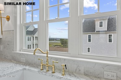 Discover unparalleled coastal living at 607a S Topsail Drive