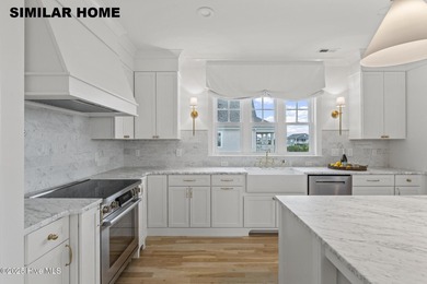 Discover unparalleled coastal living at 607a S Topsail Drive