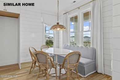 Discover unparalleled coastal living at 607a S Topsail Drive