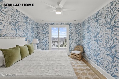 Discover unparalleled coastal living at 607a S Topsail Drive