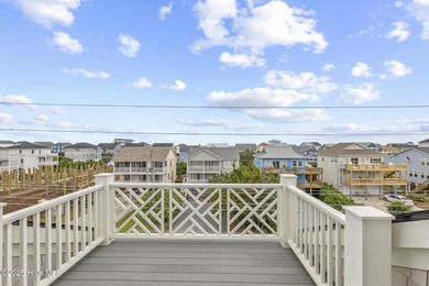 Discover unparalleled coastal living at 607a S Topsail Drive