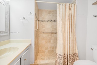 East Boca living just 1 mile from the beach. This bright 1,300