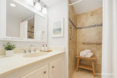 East Boca living just 1 mile from the beach. This bright 1,300