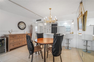 East Boca living just 1 mile from the beach. This bright 1,300