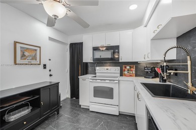 East Boca living just 1 mile from the beach. This bright 1,300