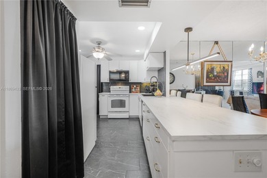 East Boca living just 1 mile from the beach. This bright 1,300