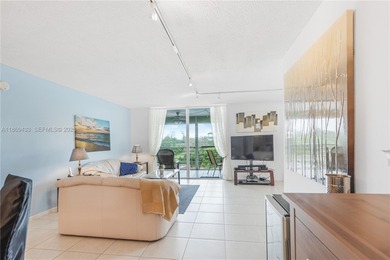 East Boca living just 1 mile from the beach. This bright 1,300