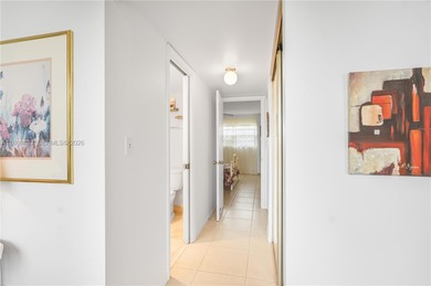 East Boca living just 1 mile from the beach. This bright 1,300