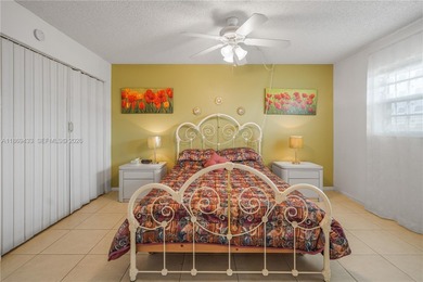 East Boca living just 1 mile from the beach. This bright 1,300