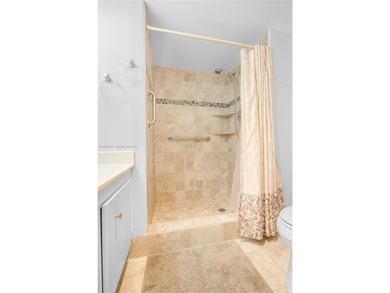 East Boca living just 1 mile from the beach. This bright 1,300