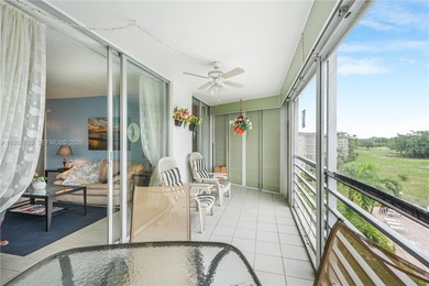East Boca living just 1 mile from the beach. This bright 1,300