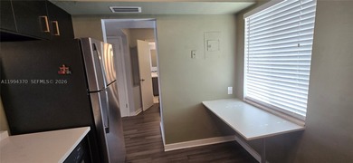 NEW IMPROVED PRICE. **Impact windows and slider thru-out this - photo 3