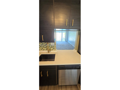 NEW IMPROVED PRICE. **Impact windows and slider thru-out this - photo 5