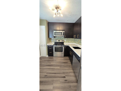 NEW IMPROVED PRICE. **Impact windows and slider thru-out this - photo 6