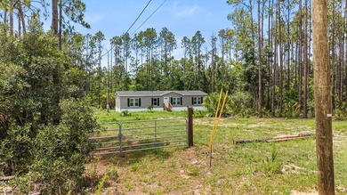 Looking for privacy, acreage, and room to roam? This like-new - photo 25