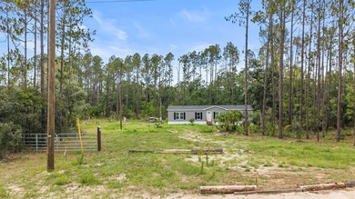 Looking for privacy, acreage, and room to roam? This like-new - photo 26