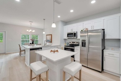 Experience the pinnacle of coastal living in the newly completed - photo 6