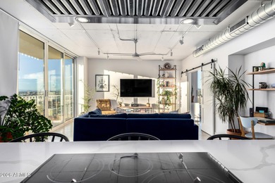 This stunning corner-unit apartment offers high-rise living with