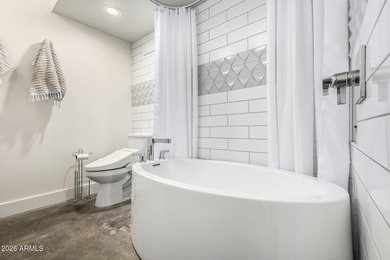 This stunning corner-unit apartment offers high-rise living with